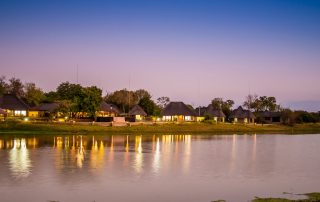 thatch-roof-houses-next-to-a-dam